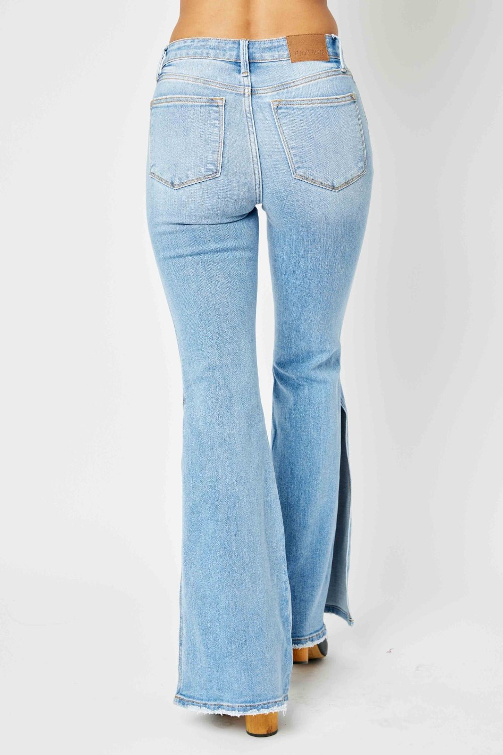 Judy Blue Full Size Mid Rise Raw Hem Slit Flare Jeans - Jeans - Medium - Bella Bourget